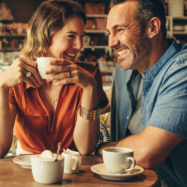 Scaling and Root Planing Middle Aged Couple at Coffee Shop